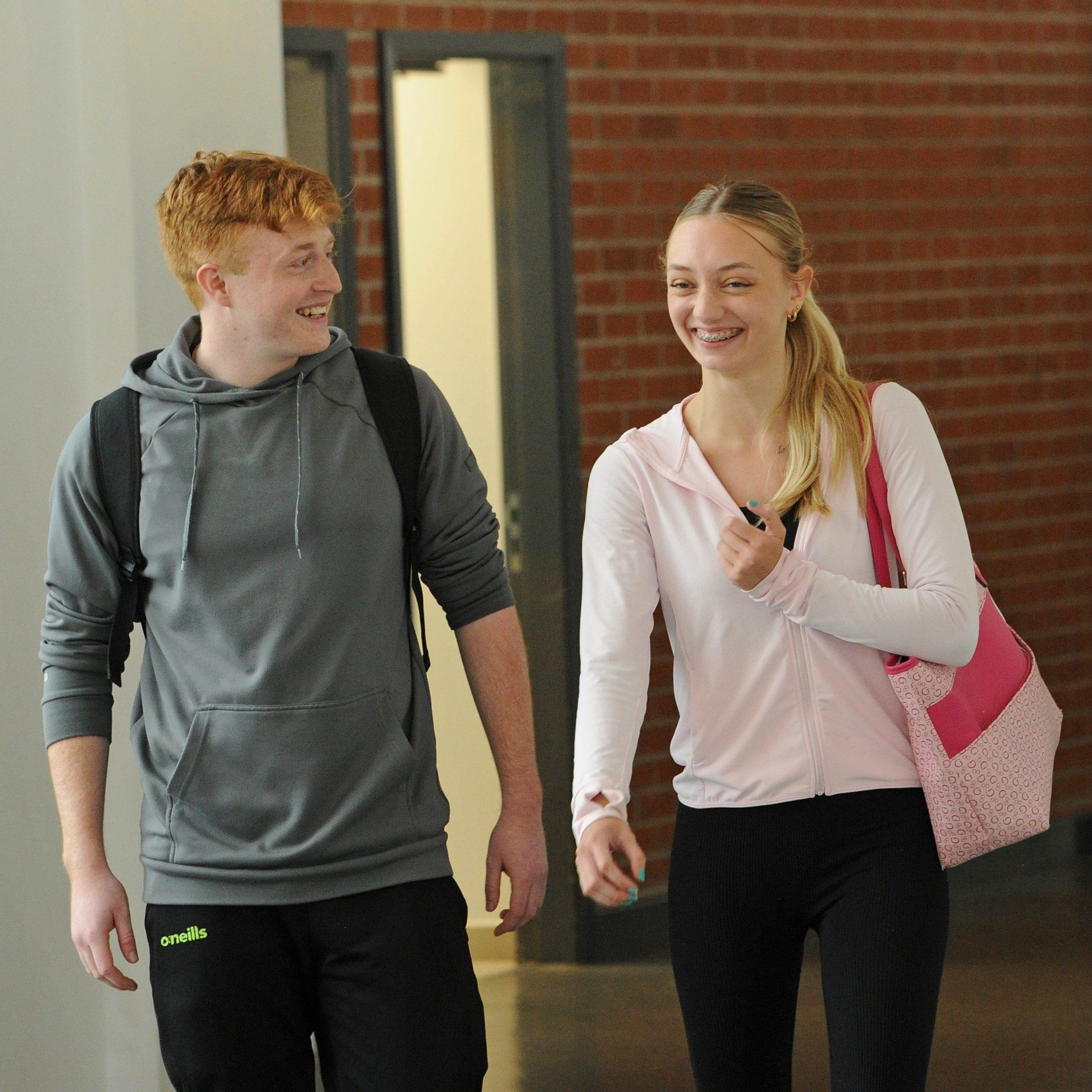 16 18 Callout Image - Students walking down corridor